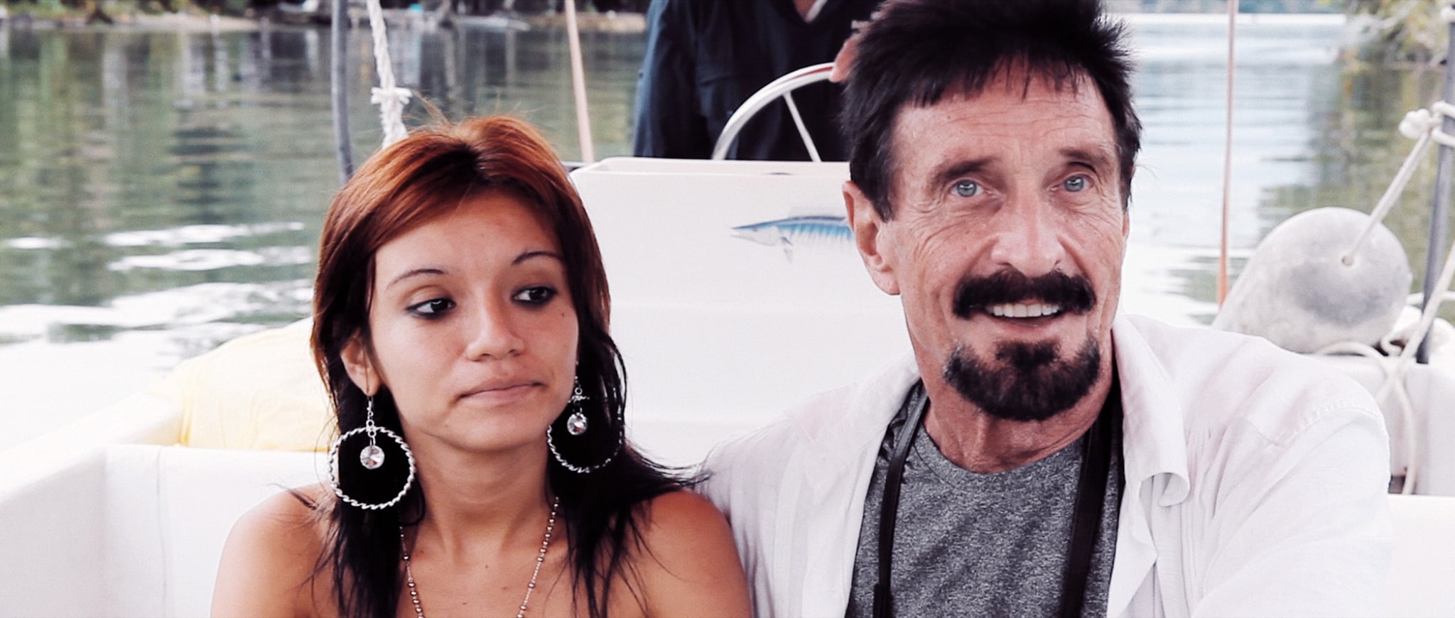 RUNNING WITH THE DEVIL: THE WILD WORLD OF JOHN MCAFEE, from left: Samantha Herrera, John McAfee, 2022. Netflix /Courtesy Everett Collection