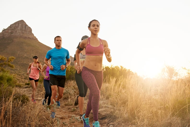 Shot of a group of friends going for a run together in nature