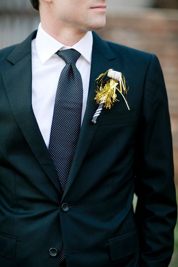 Use shiny noisemakers as boutonnieres to deck out the groomsmen.