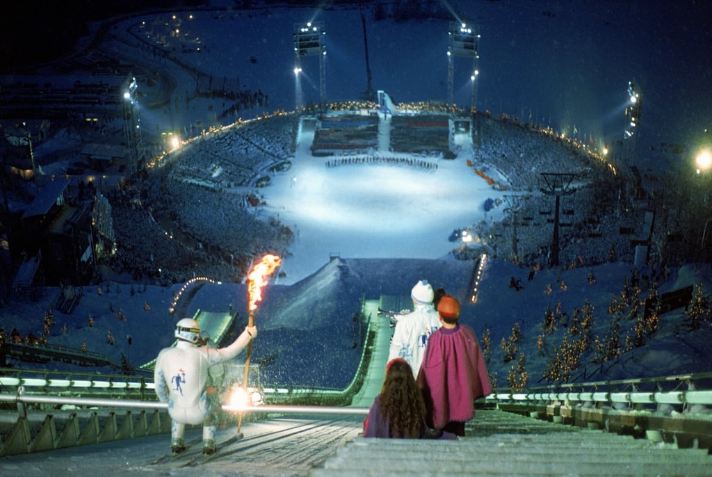 For the 1994 Lillehammer, Norway, Games, a skier carried the torch down a supersteep slope.