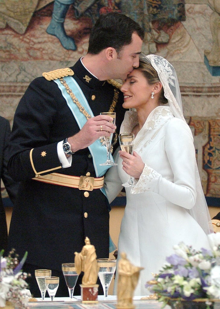 Princess Letizia was all smiles as she toasted alongside her new husband.
