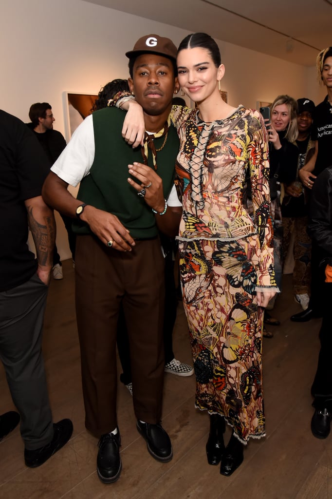 Who says you can't wear a sweater vest to a party? Here, Tyler styled his with brown trousers and a Golf Wang hat with Kendall Jenner.