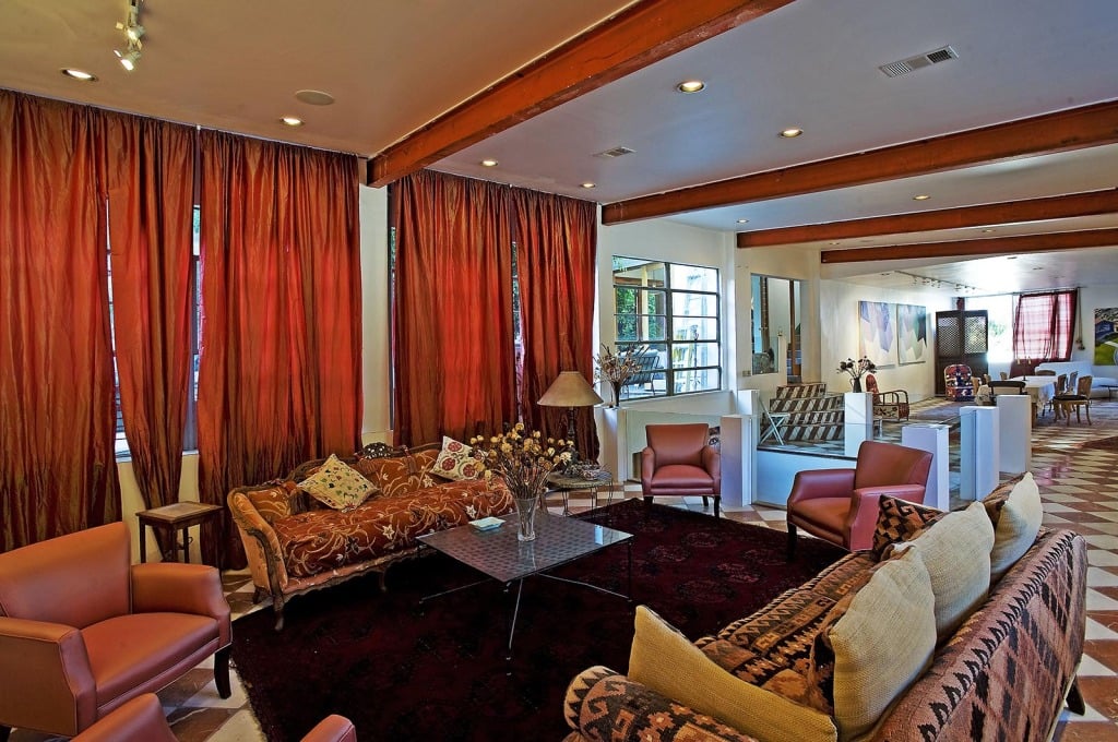 Low beamed ceilings give some of the rooms a cozy vibe. 
Source: Everett Fenton Gidley