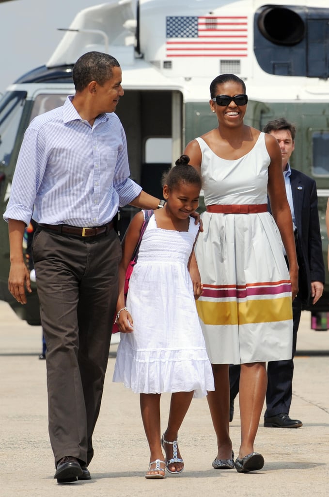 Michelle in a white striped tank dress on her way to Martha's Vineyard.