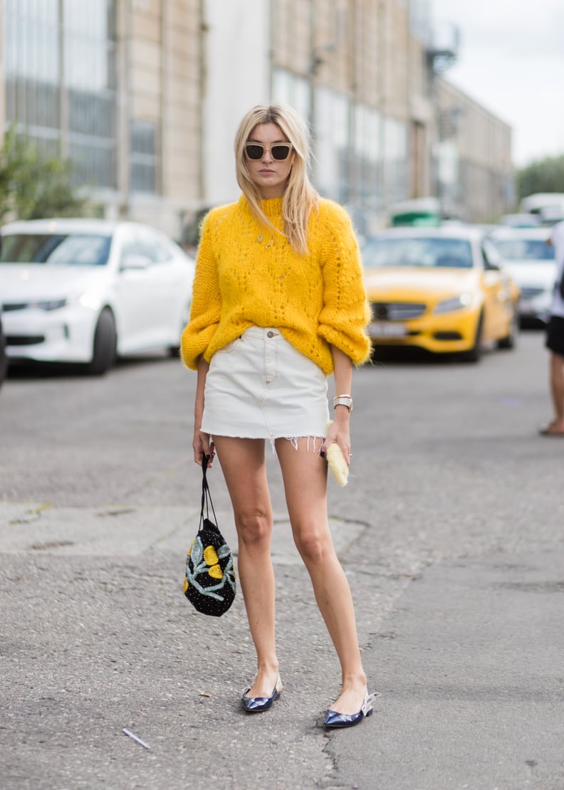 Opt For a Cheery Yellow Sweater and a White Denim Skirt