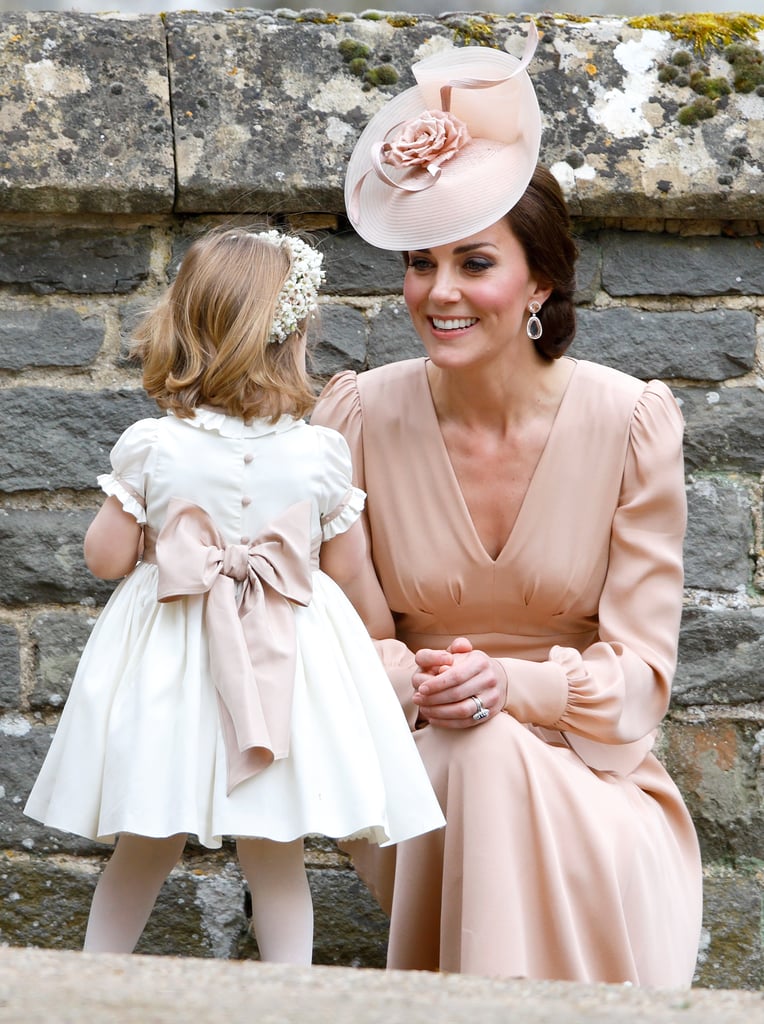 Kate took a moment during Pippa's wedding to smile adoringly at Charlotte.