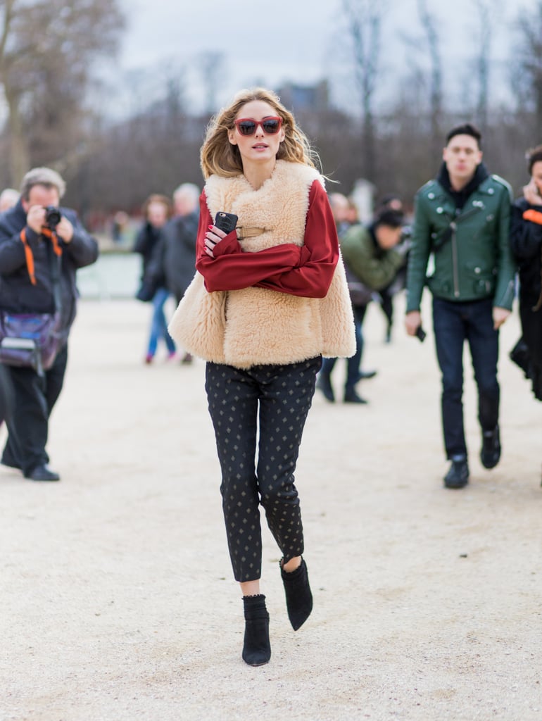 Olivia Palermo makes wearing an oversize shearling vest look easy. She kept some pieces simple – printed jeans and red top — to let the outerwear become the statement item.