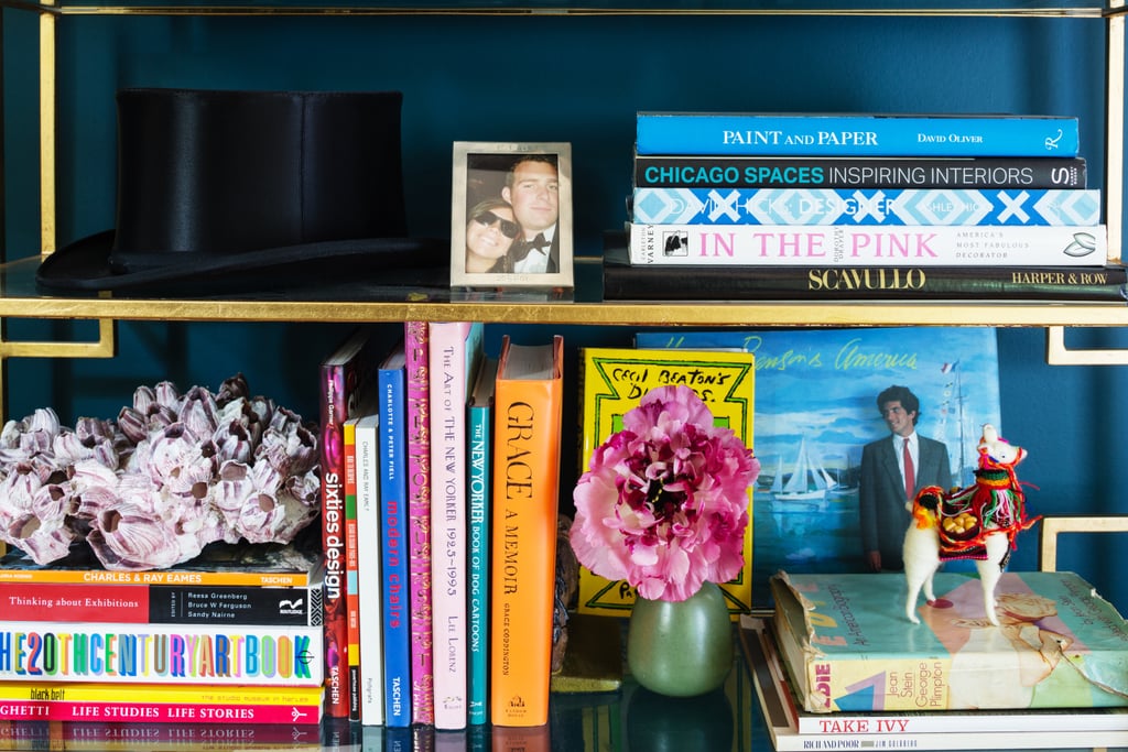 An enviable collection of books is on display in the den. Lizzie favors tomes with a few tears for a sense of history.