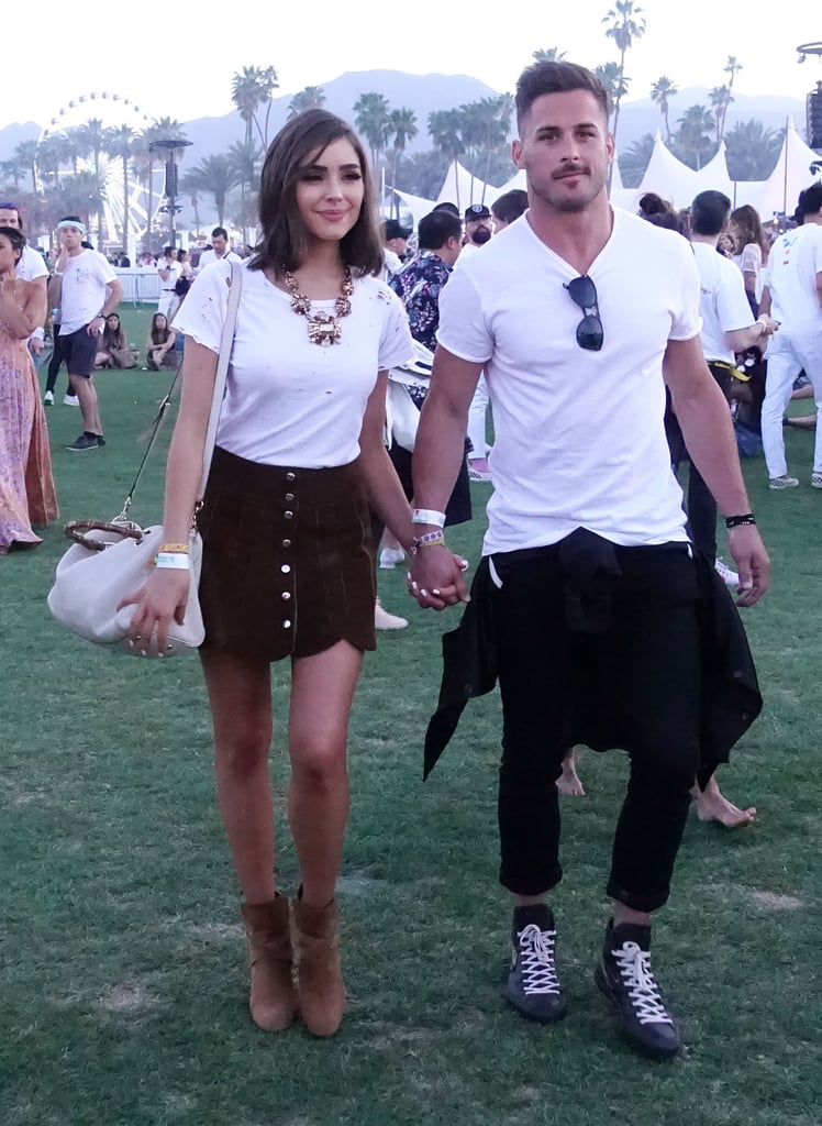 Olivia Culpo wearing a white tee and miniskirt at the festival. 