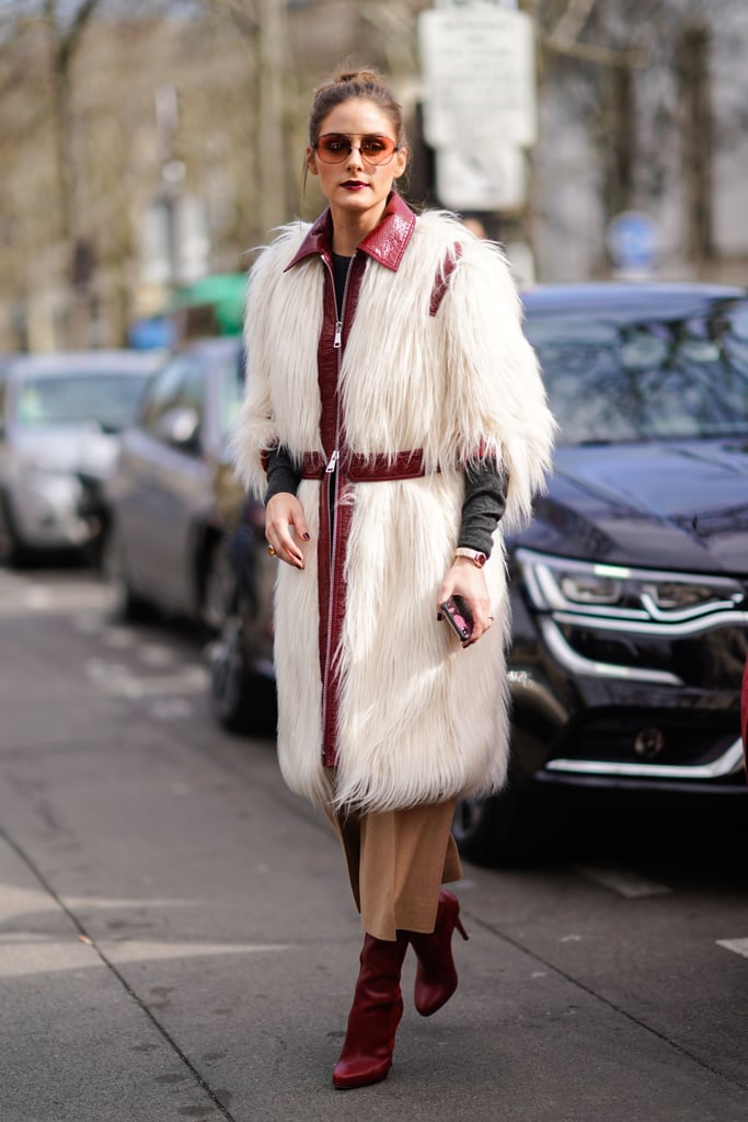 Olivia stayed warm in a white furry coat outside of the Giambattista Valli show. She accessorized with a pair of Westward Leaning sunglasses.