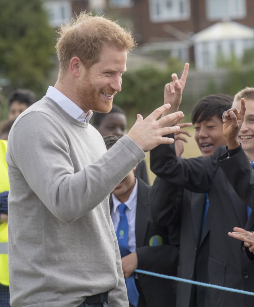 Prince Harry Hugs Kids at Lealands High School
