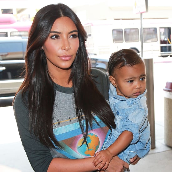 Kim Kardashian Carrying North West in LAX | Photos
