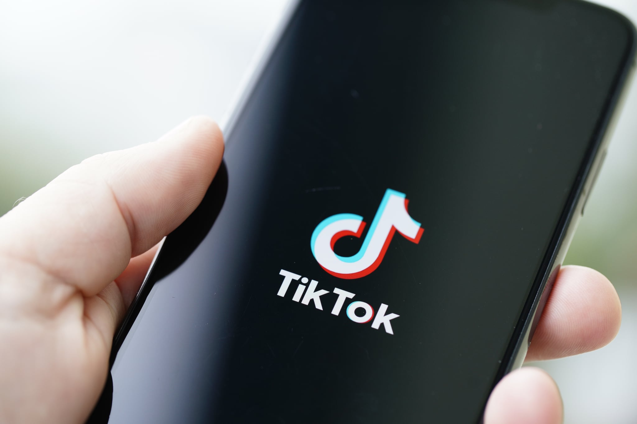 The TikTok logo is seen on an iPhone 11 Pro max in this photo illustration in Warsaw, Poland on September 29, 2020. The TikTok app will be banned from US app stores from Sunday unless president Donald Trump approves a last-minute deal between US tech firm Oracle and TikTok owner ByteDance. US authorities say the Chinese video sharing app threaten national security and could pass on user data to China. (Photo by Jaap Arriens/NurPhoto via Getty Images)