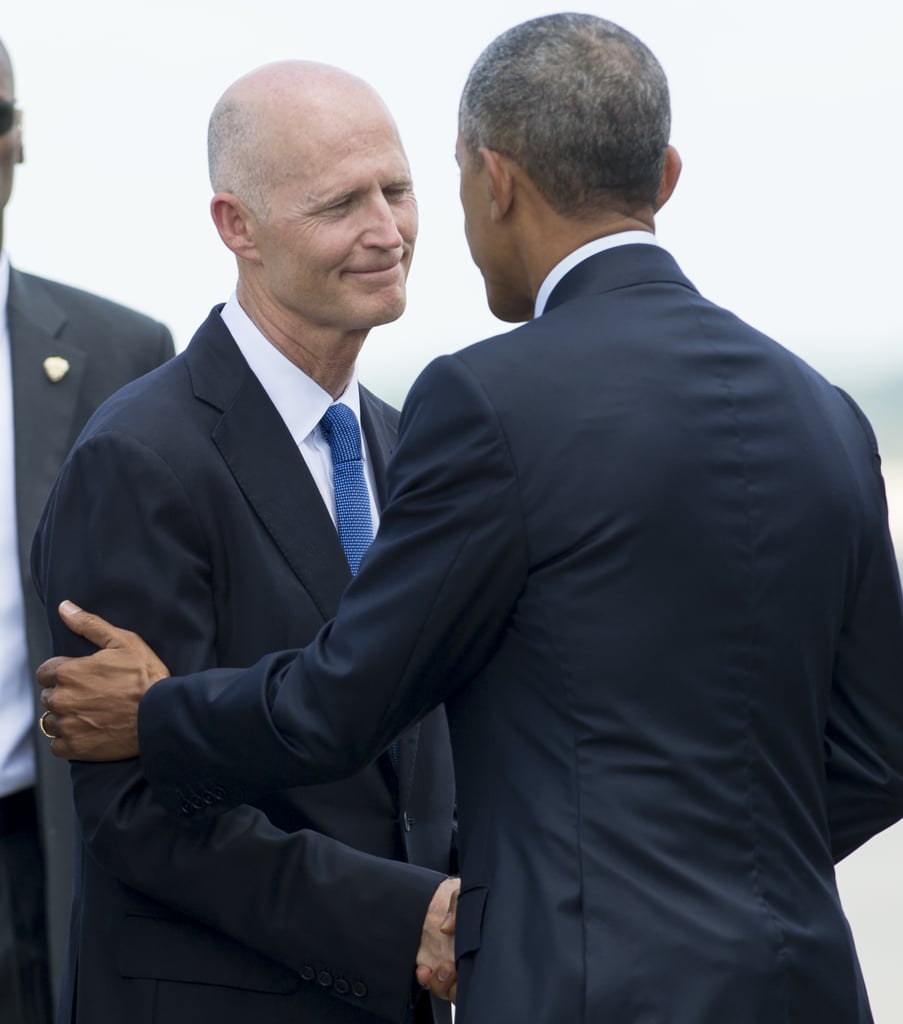 President Obama shakes hands with Florida Republican Governor Rick Scott at the Orlando International Airport.