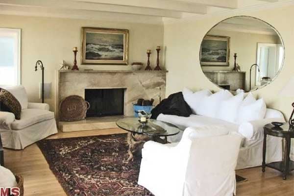 A cozy living room is the perfect place for entertaining or playing games after a long day catching waves.