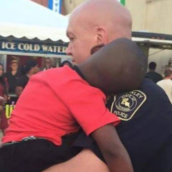 Cop Holding Lost Boy at Fair