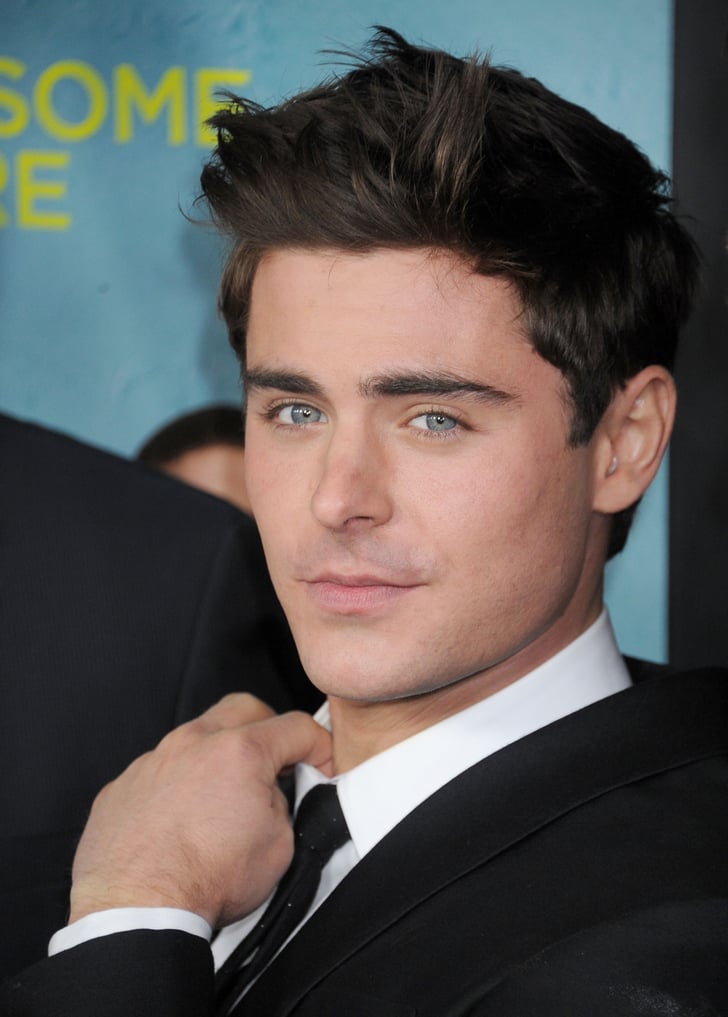 Uhoh — ignore how his oceanblue eyes match the backdrop. Sexy Zac