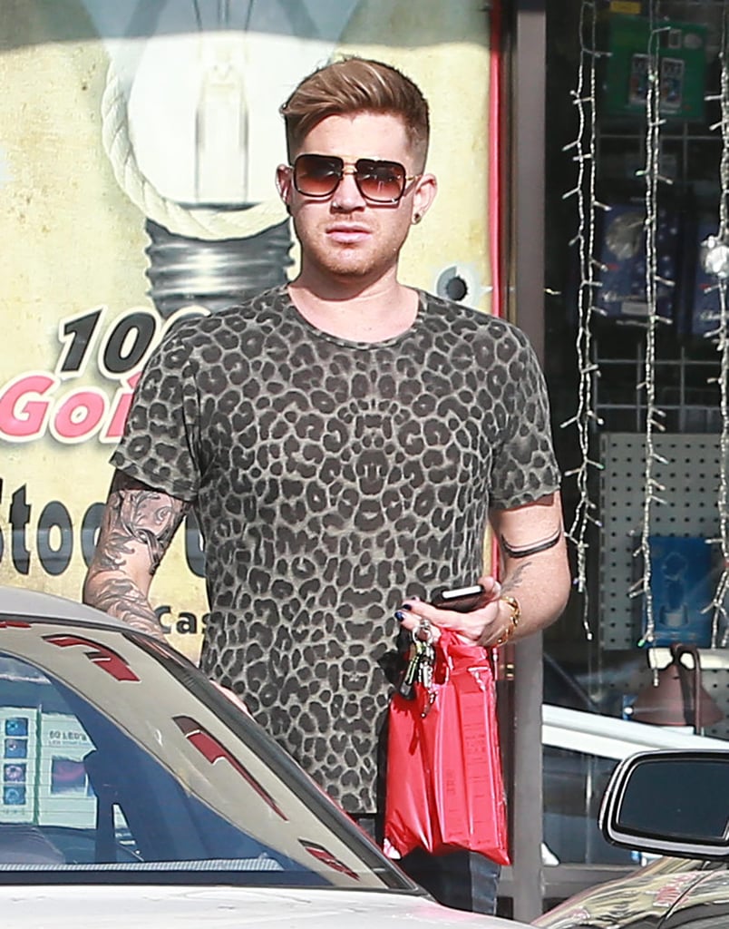 Adam Lambert revealed his sleeve of tattoos in a leopard-print t-shirt during his shopping trip in LA on Friday.