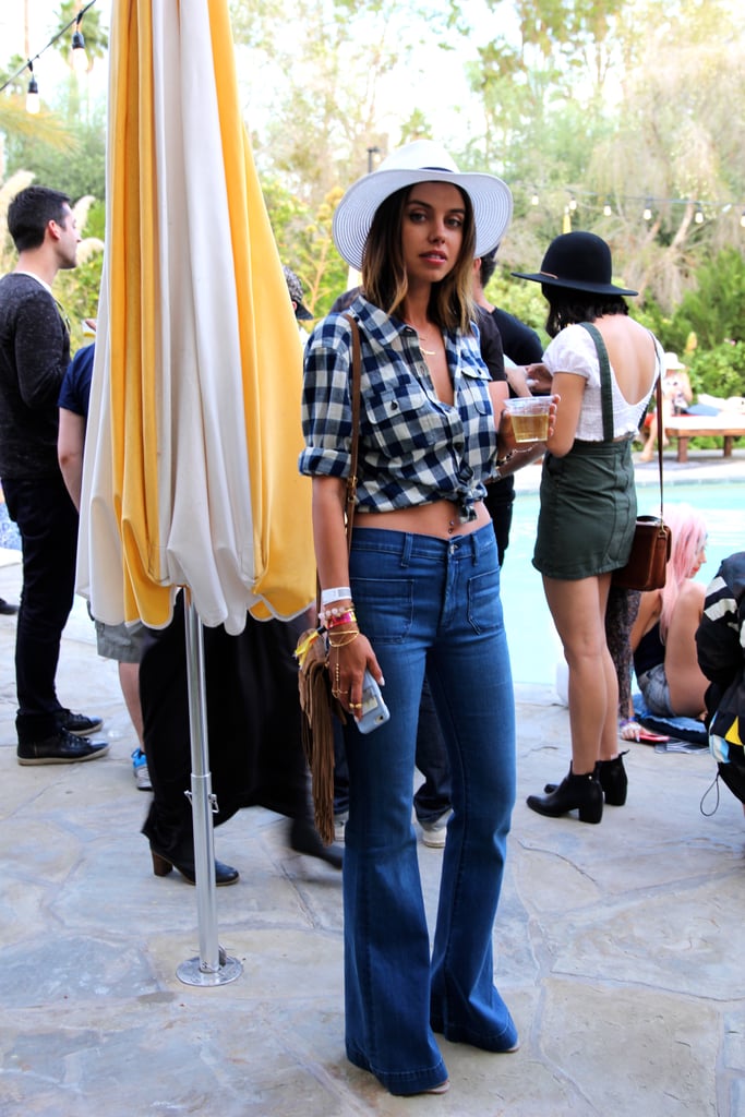 High-waist Hudson flares met a gingham A.P.C. crop top. A white fedora and a neutral fringe bag were just the right accessories.