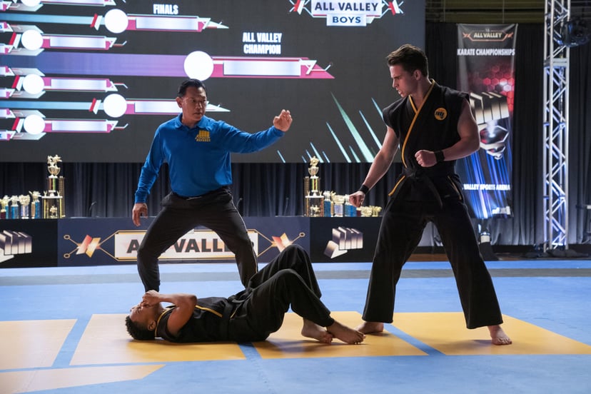 COBRA KAI, foreground from left: Dallas Dupree Young, Tanner Buchanan, (Season 4, Episode 409, aired Dec. 31, 2021). photo: Curtis Bonds Baker / Netflix / Courtesy Everett Collection
