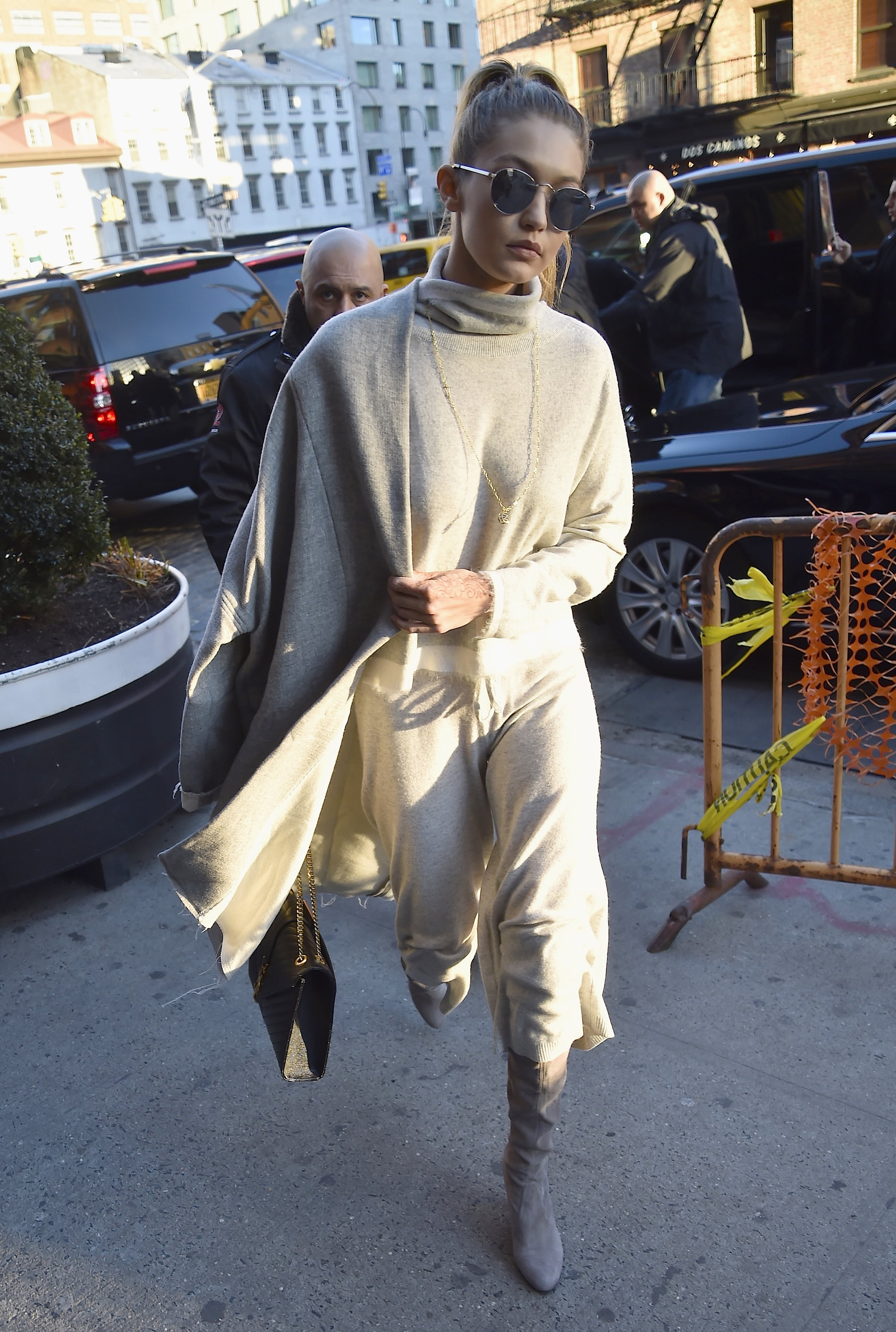 Gigi Hadid wears a grey turtleneck sweater and black leggings while  shopping in Manhattan, New York