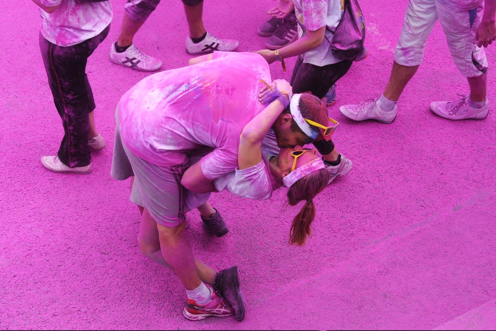 A couple kissed in a sea of pink during the first-ever Paris Color Run, which followed a route between city hall and the Eiffel Tower.