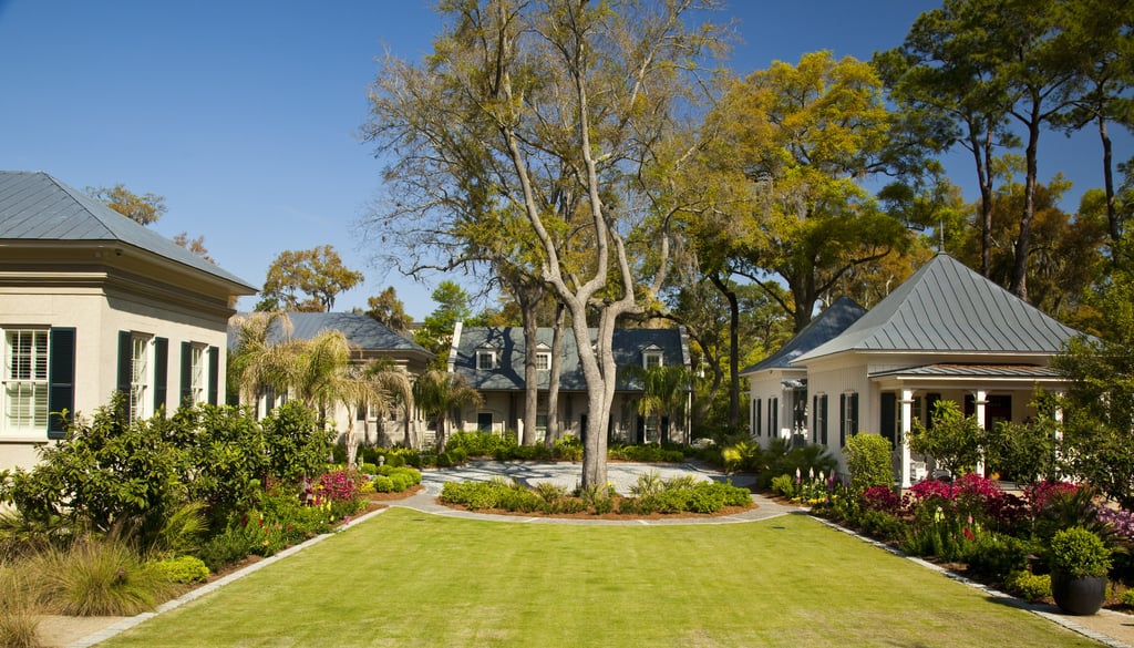 A stocked pond and croquet court are tucked into the 5.5-acre property.