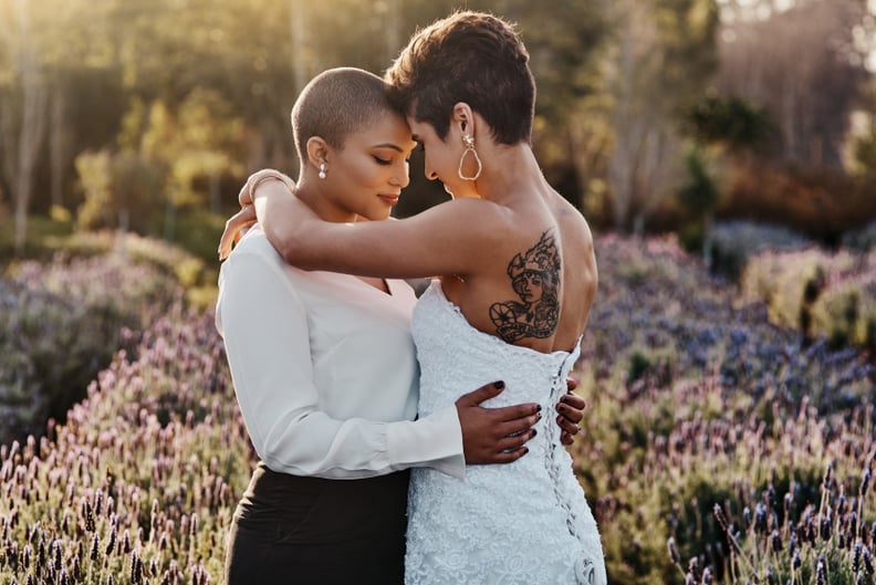Cropped shot of a young couple standing together on their wedding day