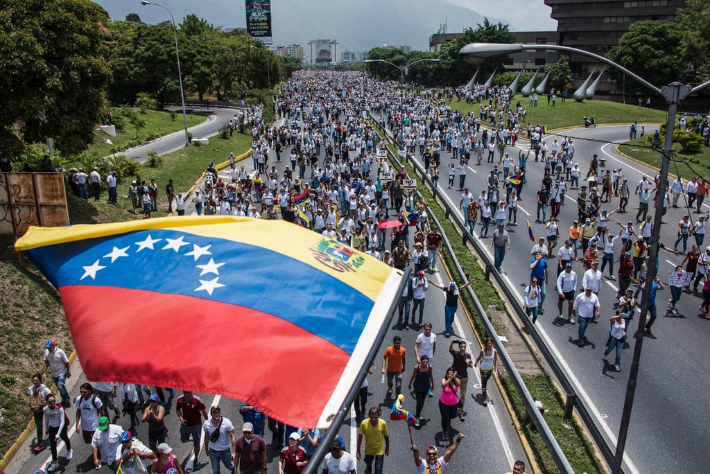 Protesters march down Francisco Fajardo Highway in Caracas.