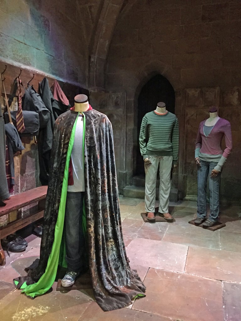 Alas, the invisibility cloak isn't actually invisible, but the lining is green for the purpose of appearing so in front of a green screen.