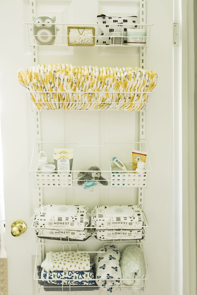 This Easy Move Adjustable Basket Organiser ($50) has high review ratings for good reason. It can be wall-mounted or hung over a door and can store everything from cleaning supplies to pantry items, and in this case, nursery essentials. I loaded it with nappies, wipes, nappy rash cream, medicine cabinet items, dummies and receiving blankets, and the closet door still closes like a charm.