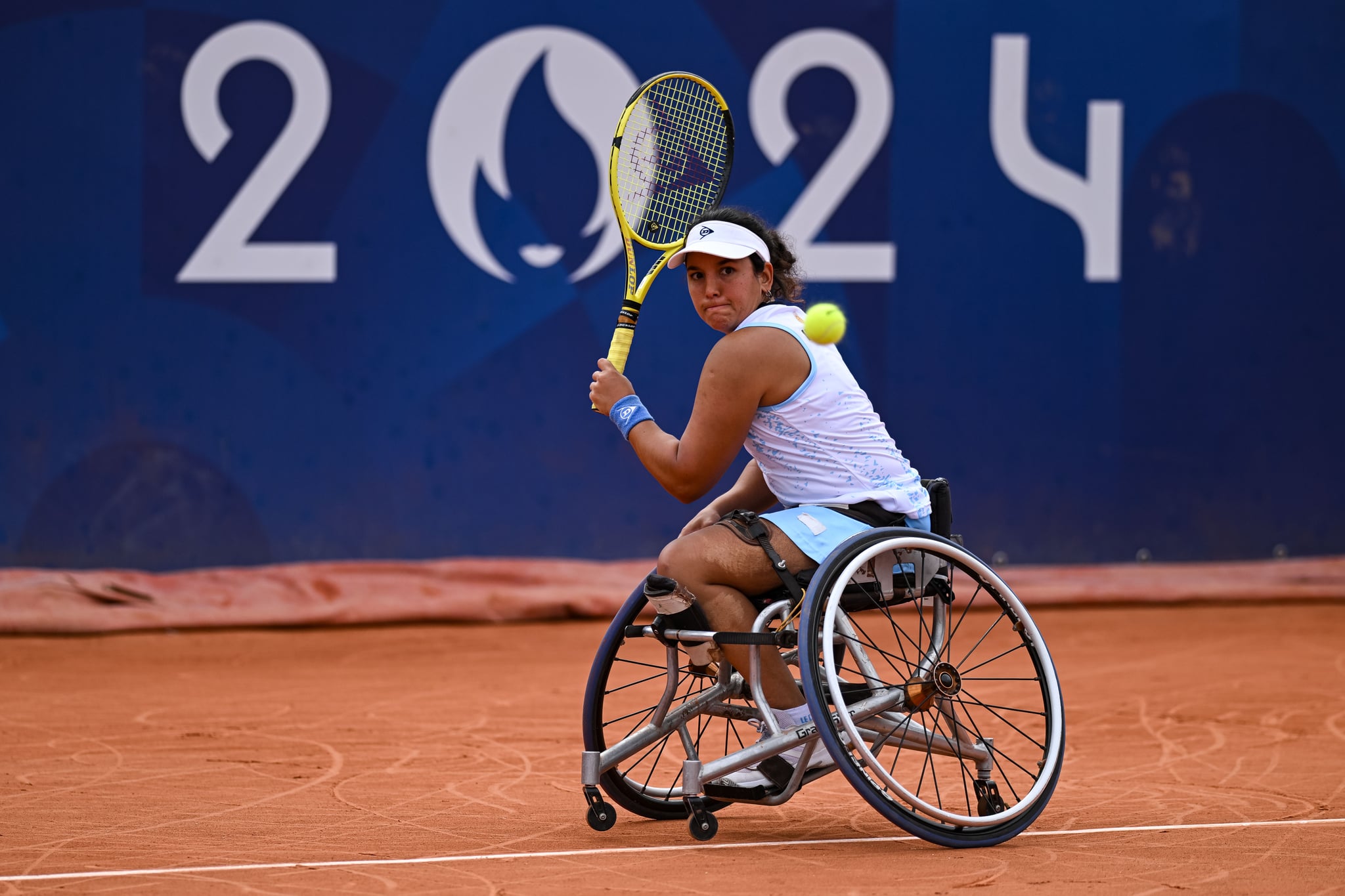 PARIS, FRANCE - AUGUST 31: Maria Florencia Moreno of Argentina in action against Saki Takamuro of Japan in the Women's Wheelchair Tennis Singles first round match on day three of the Paris 2024 Summer Paralympic Games at Roland Garros on August 31, 2024 in Paris, France. (Photo by Daniel Kopatsch/Getty Images)