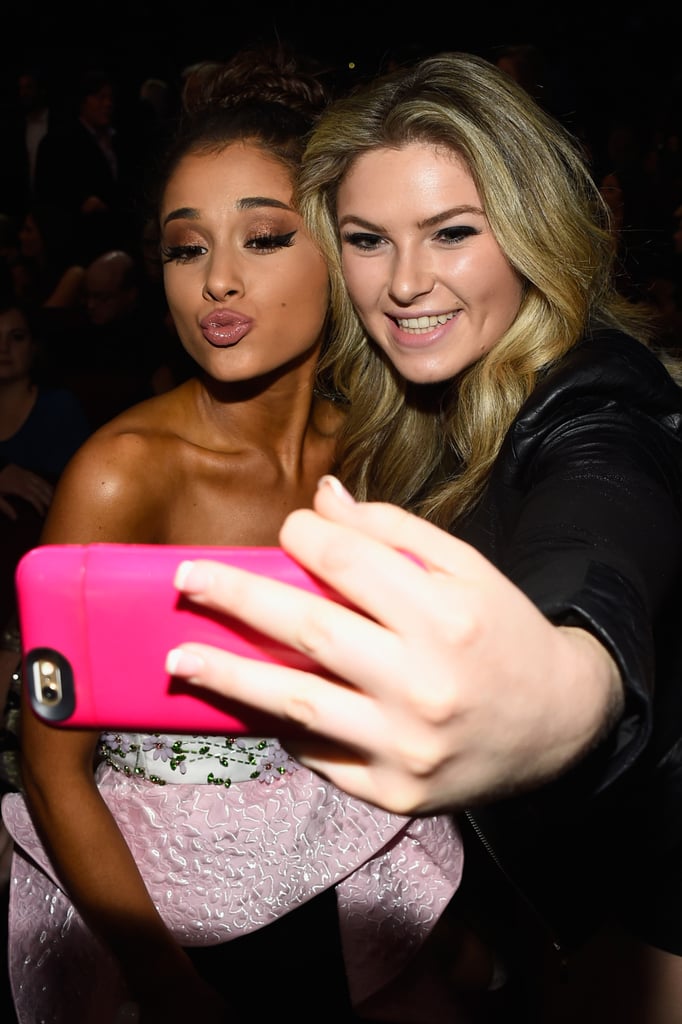 Ariana Grande Posing For Photos With a Fan