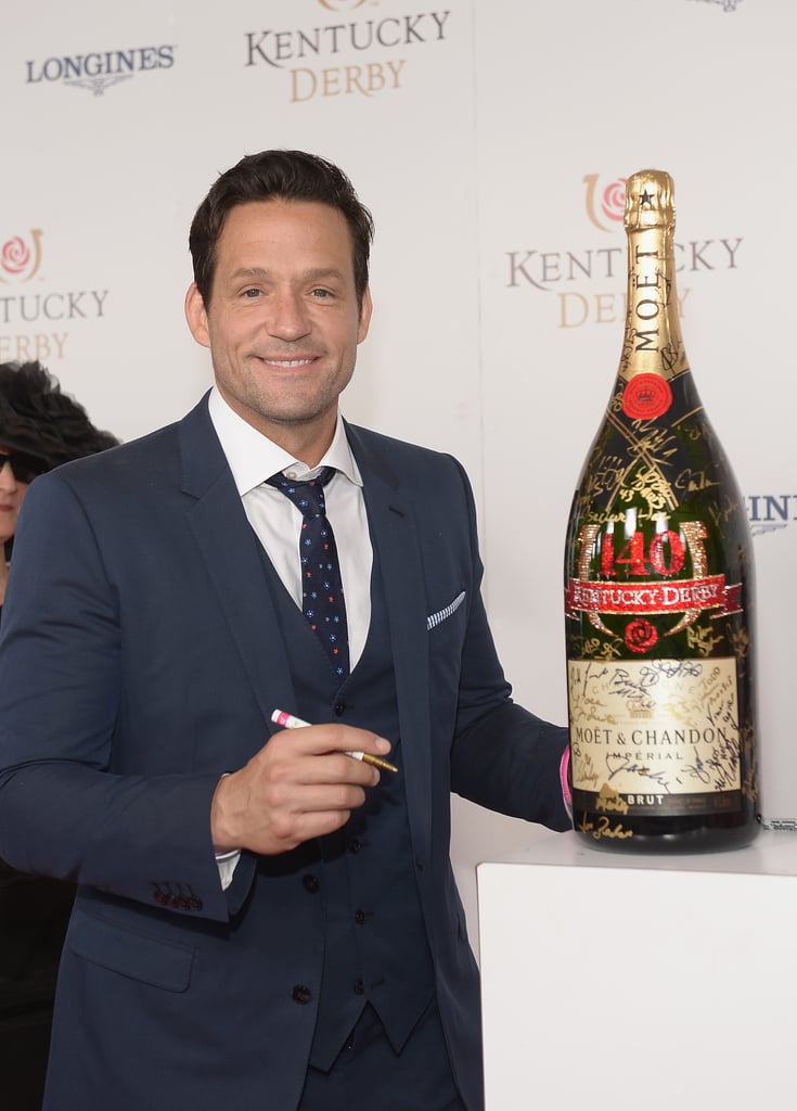 Josh Hopkins signed the bottle of Champagne on the red carpet.