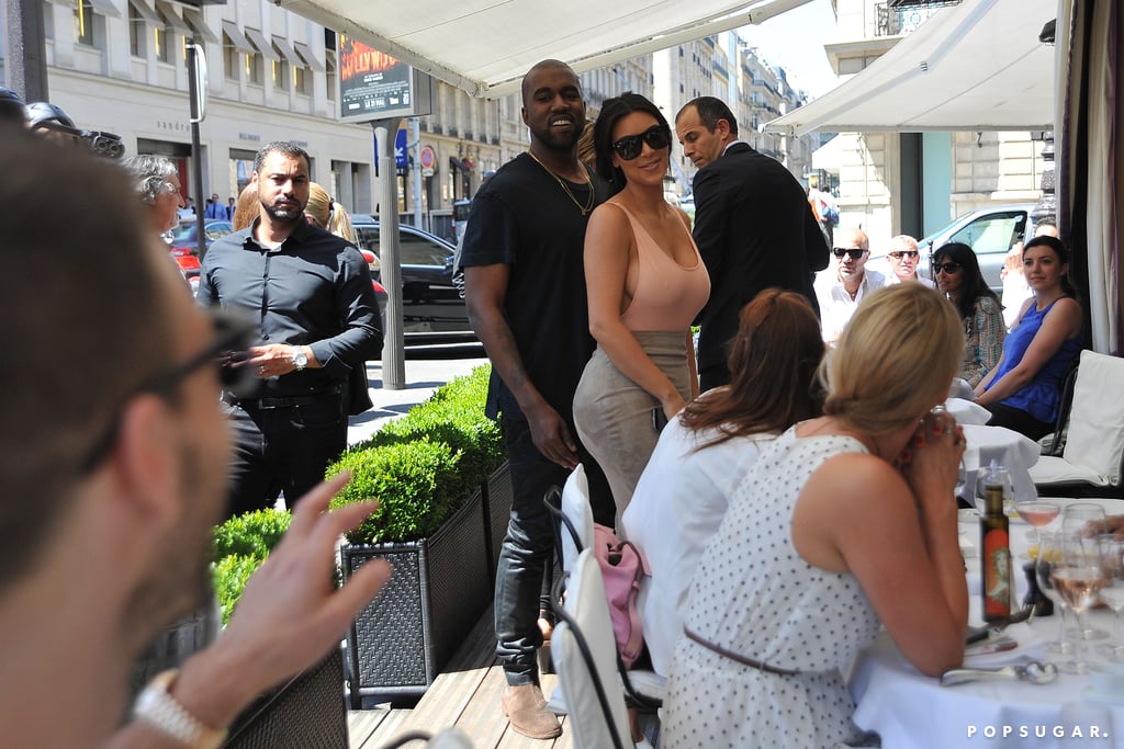 Kanye flashed a smile while greeting fans with Kim.