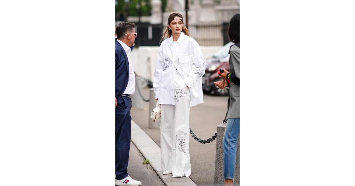 Gigi Hadid Wears Backwards Baseball Cap at Louis Vuitton Fashion