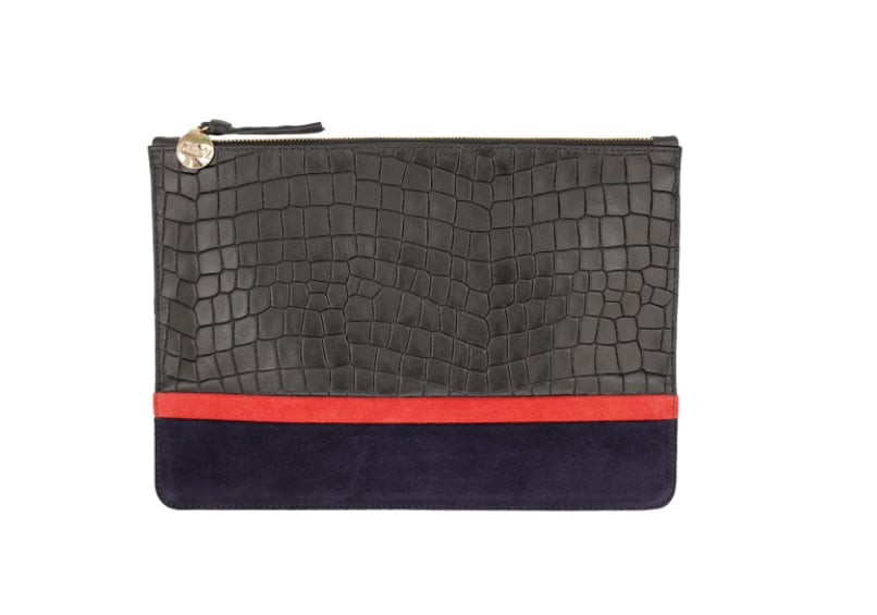 "Scarves, hats, gloves — with all the paraphernalia that comes with cold-weather dressing I like to keep my other accessories minimal. Instead of a big shoulder bag I carry a small clutch like this one from Clare V. ($245) and always opt for the monogram service to add a personal touch." — MN