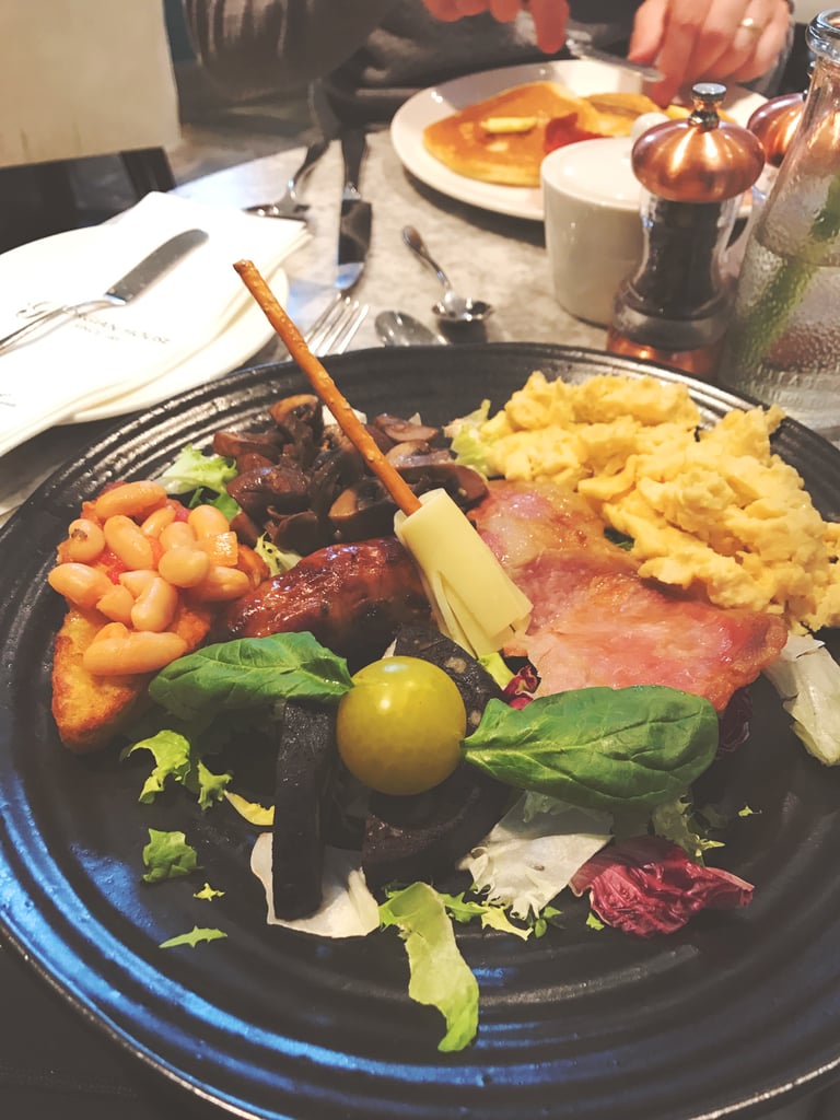 I chose the Forbidden Feast, which is a slight twist on the full English breakfast of back bacon, scrambled eggs, tomatoes, mushrooms, black pudding, baked beans, sausage, and hash browns. Note the cheese and pretzel "broomstick" and the cherry tomato "Golden Snitch." Yummy and adorable!