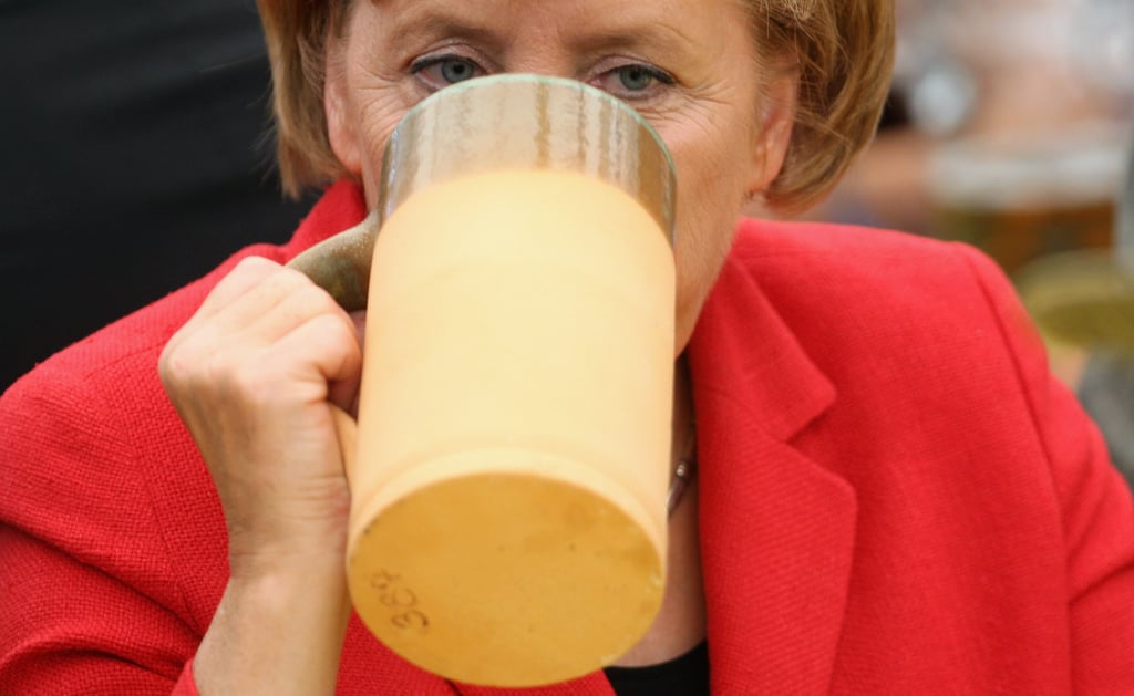 Angela Merkel threw back a stein during a 2009 rally.