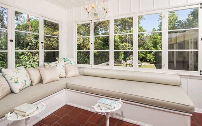 A chic daybed surrounded by sunlight? Yes, please!