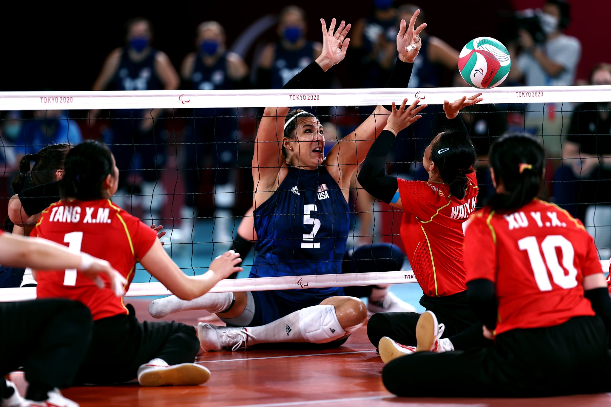 TOKYO, JAPAN - SEPTEMBER 05:  Kathryn Holloway of Team United States and Yanan Wang of Team China go for the ball during the Women's Sitting Volleyball gold match between and China and USA on day 12 of the Tokyo 2020 Paralympic Games at Makuhari Messe Hall on September 05, 2021 in Chiba, Japan. (Photo by Dean Mouhtaropoulos/Getty Images)