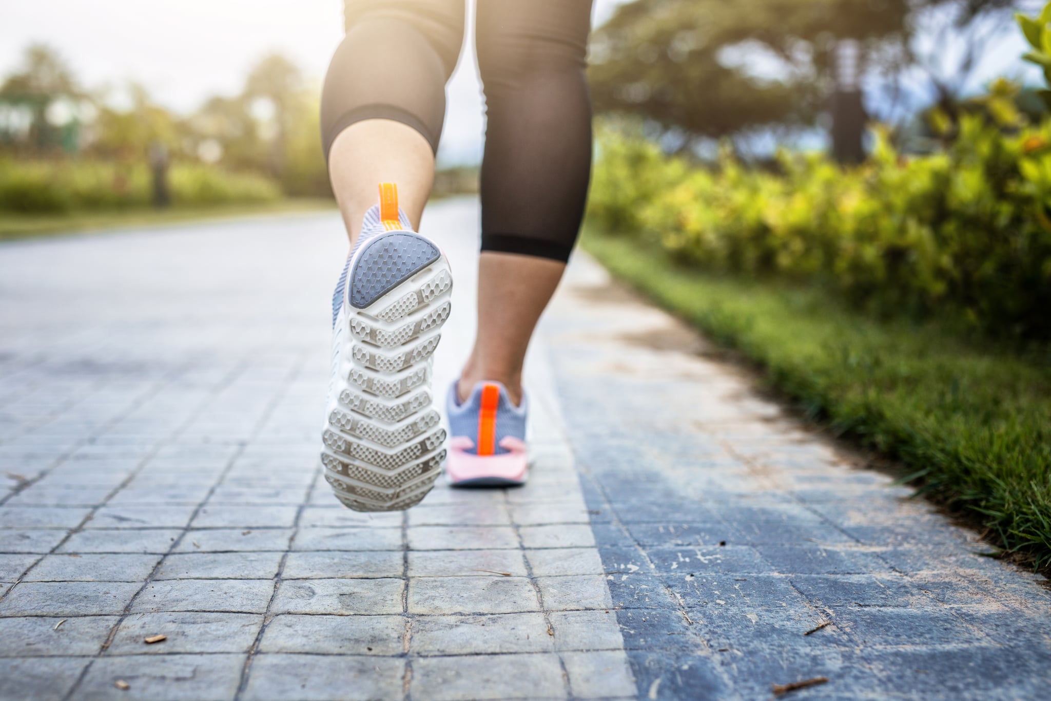 young fitness woman runing in the park.