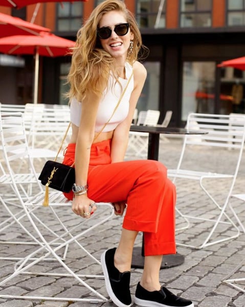 A White Crop Top, Orange Trousers, Black Slip-Ons, and a Crossbody Bag ...