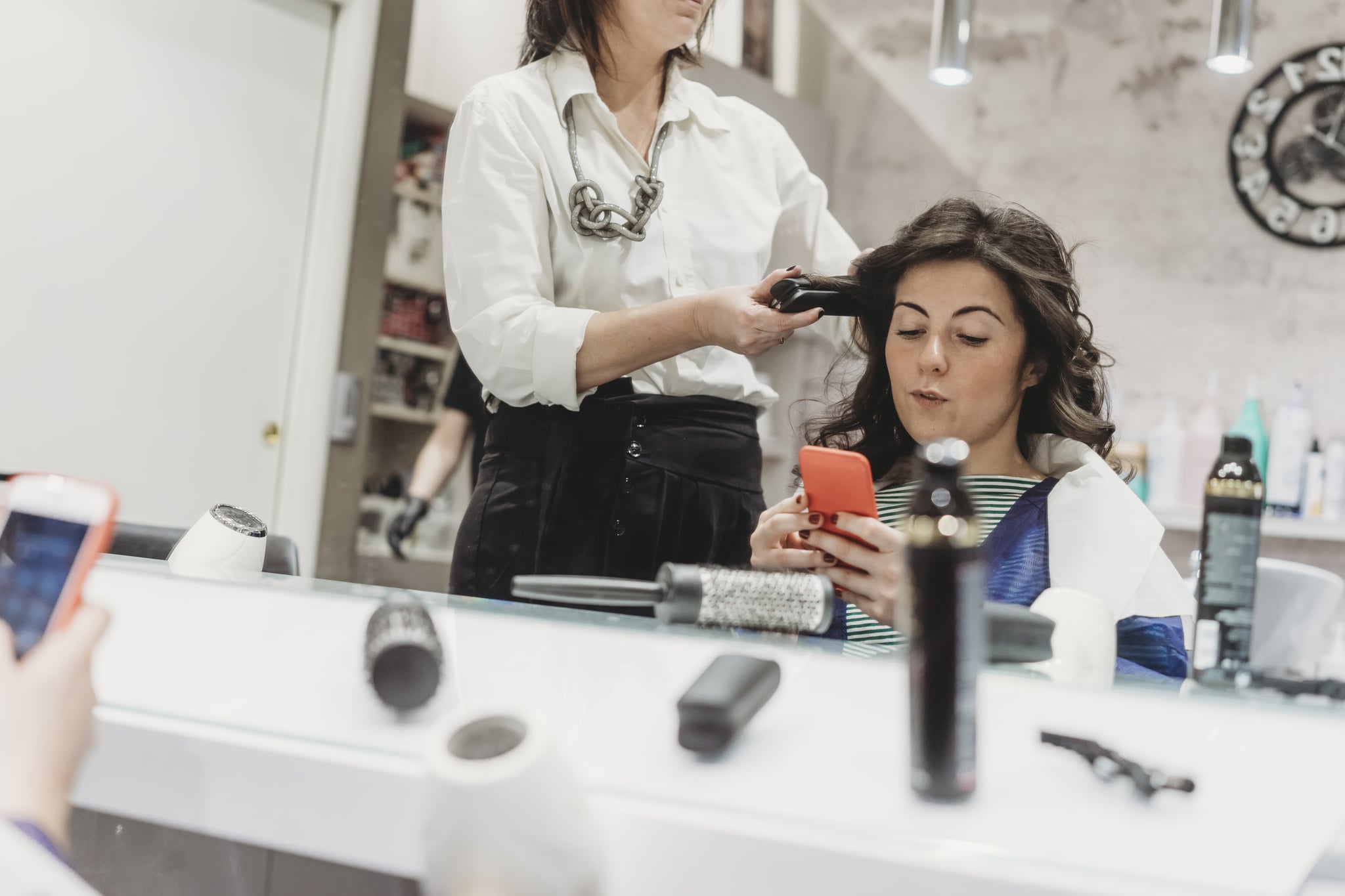 Young adult woman at the hairdresser