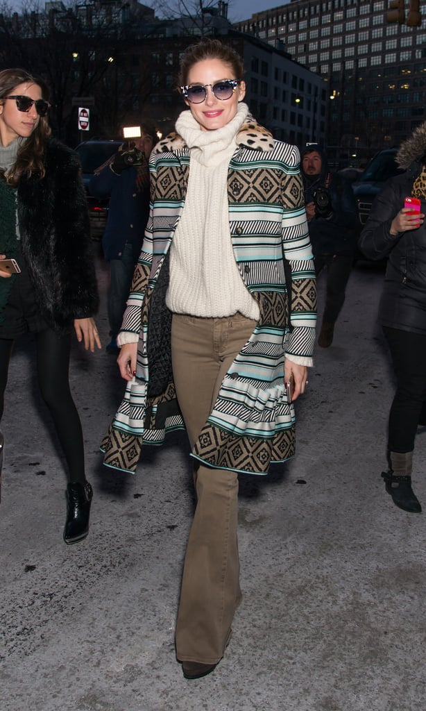 At DVF, Olivia kept it cozy despite freezing temperatures by pairing an oversize turtleneck with a bold graphic coat.