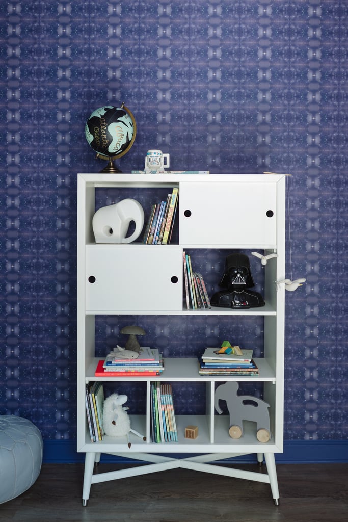 The Darth Vader phone has pride of place on the Mid-Century French White Bookcase ($899). The patterned wallpaper is from Eskayel.
