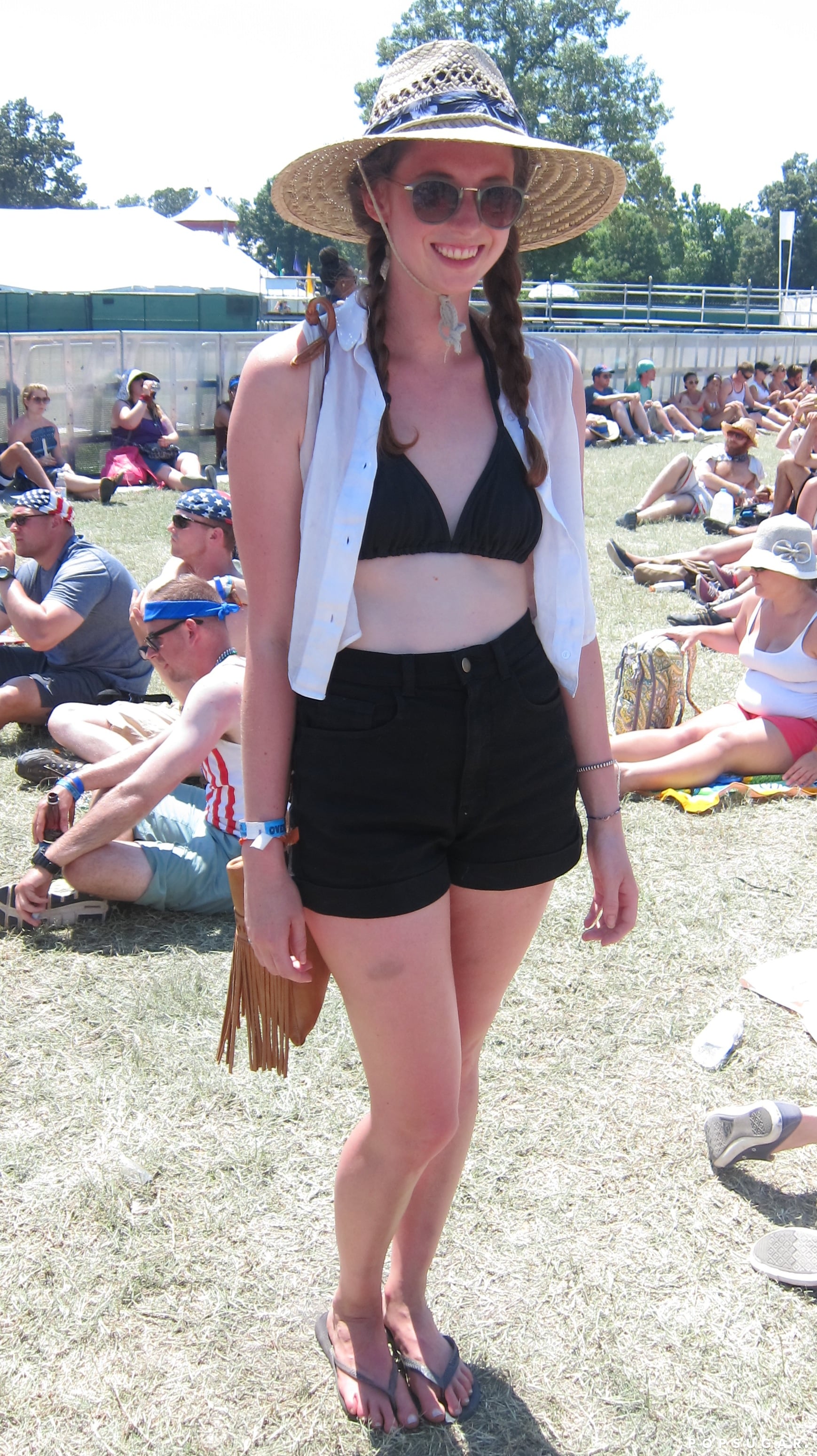 Music festival outfit idea: Cropped tee shirt, flannel shirt, ripped denim  shorts, stack of bracelets,…