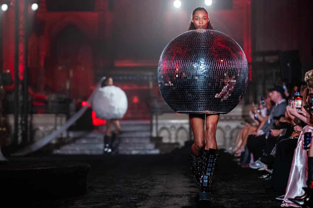 "[Pete Burns] portrays the joy but also the tragedy that's inflicted upon the queer experience in pop culture."
 "There is a disco-ball-themed look," he says. "She's a big, big slay, and we all love her in the office. I've danced around in her a number of times."
The inspiration for this collection is "really based on Pete Burns," Cowan reveals. The queer British club icon was in the band Dead or Alive and is perhaps best known for the hit song "You Spin Me Round (Like a Record)." 
In every show, Cowan selects a different queer figure who he thinks "portrays the joy but also the tragedy that's inflicted upon the queer experience in pop culture." "Pete Burns was an icon to me growing up," he says. "In the UK, I think they really symbolized a punk attitude toward beauty and glamour and an unapologeticness that I just wanted to pay homage to."