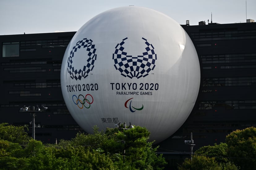 The Tokyo 2020 Olympic and Paralympic logos are displayed on the Hinomaru driving school building in Tokyo on June 29, 2020. (Photo by CHARLY TRIBALLEAU / AFP) (Photo by CHARLY TRIBALLEAU/AFP via Getty Images)