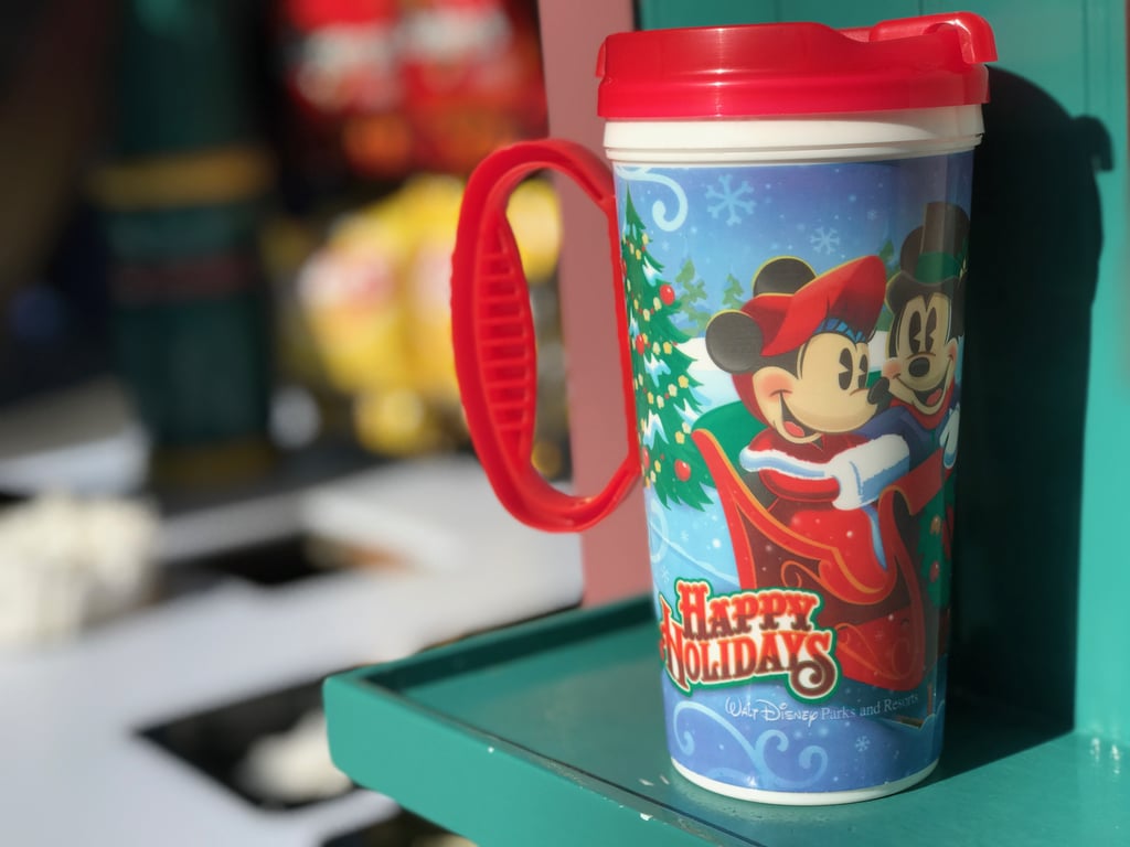 Get a warm wintry refreshment in a "Happy Holidays" travel mug.